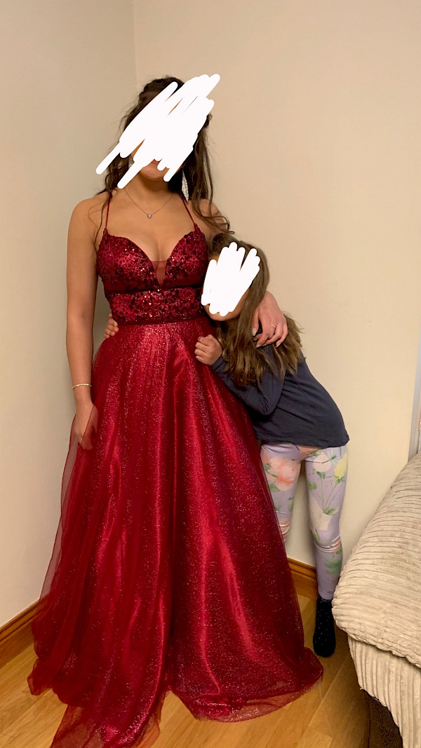 Dani’s Closet and Showroom burgundy debs dress